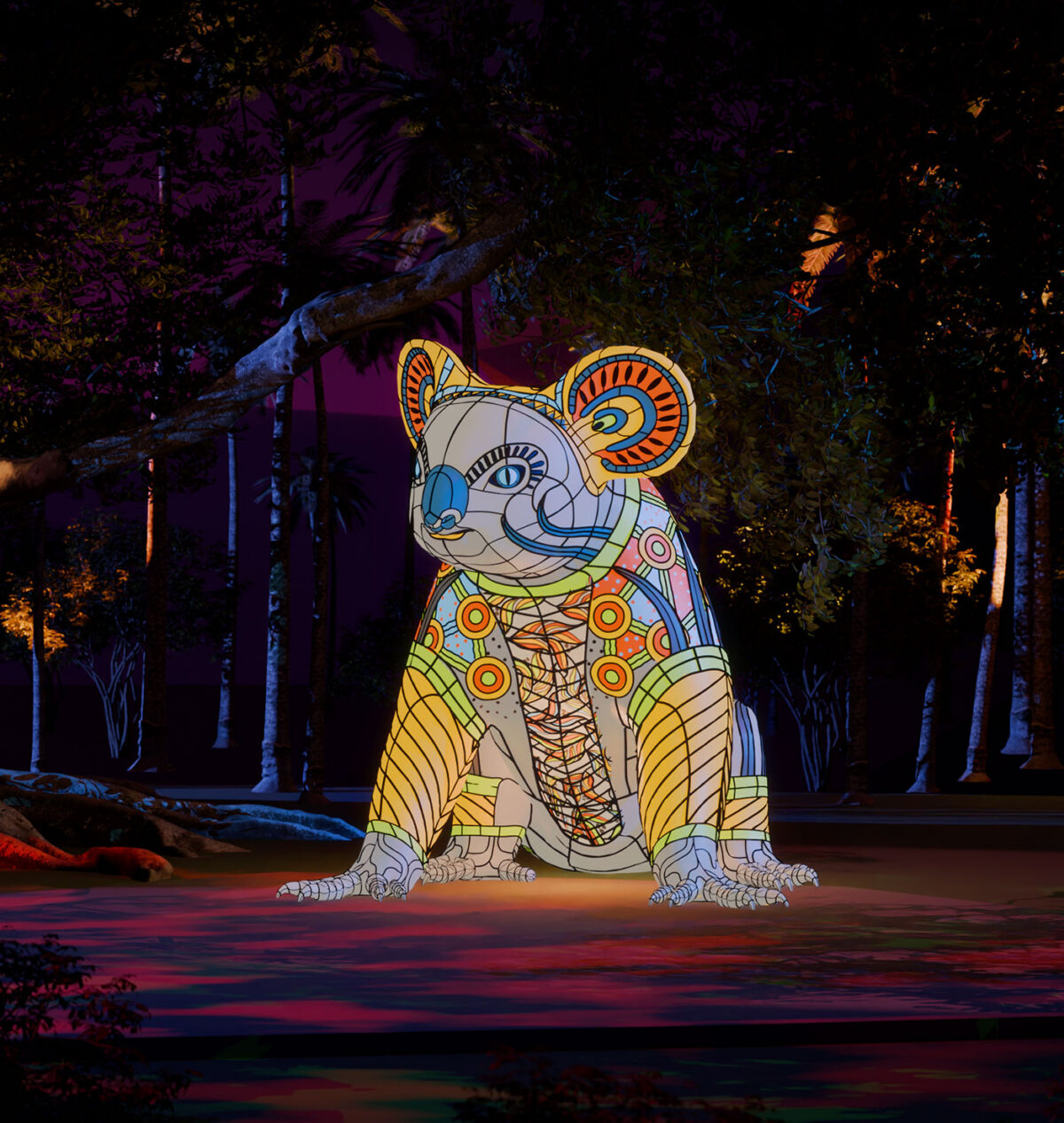 Large Koala Lantern in colourful design sat on the ground outside in nature
